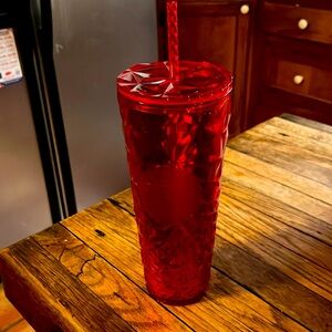 24oz red Starbucks cup.